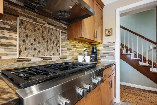 a kitchen with a refrigerator and countertop