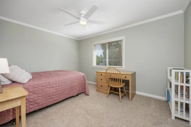 a room with a bed and a window