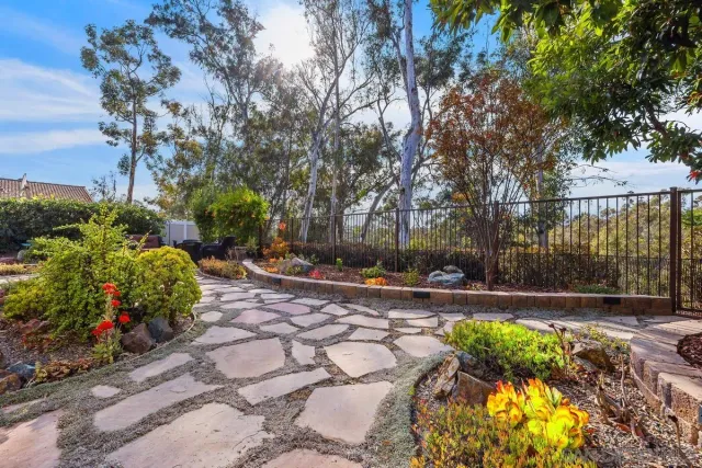 a view of a house with backyard porch and sitting area