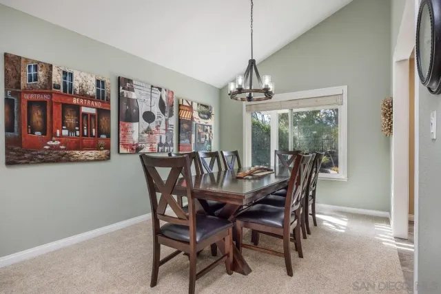 a kitchen with stainless steel appliances kitchen island granite countertop a refrigerator and cabinets
