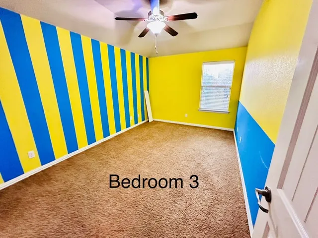 a room with a bed and a window