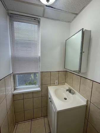 a bathroom with a sink and mirror
