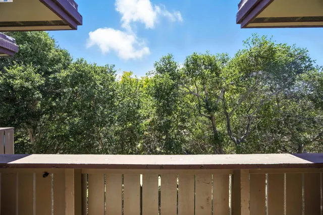 a view of a yard from a balcony