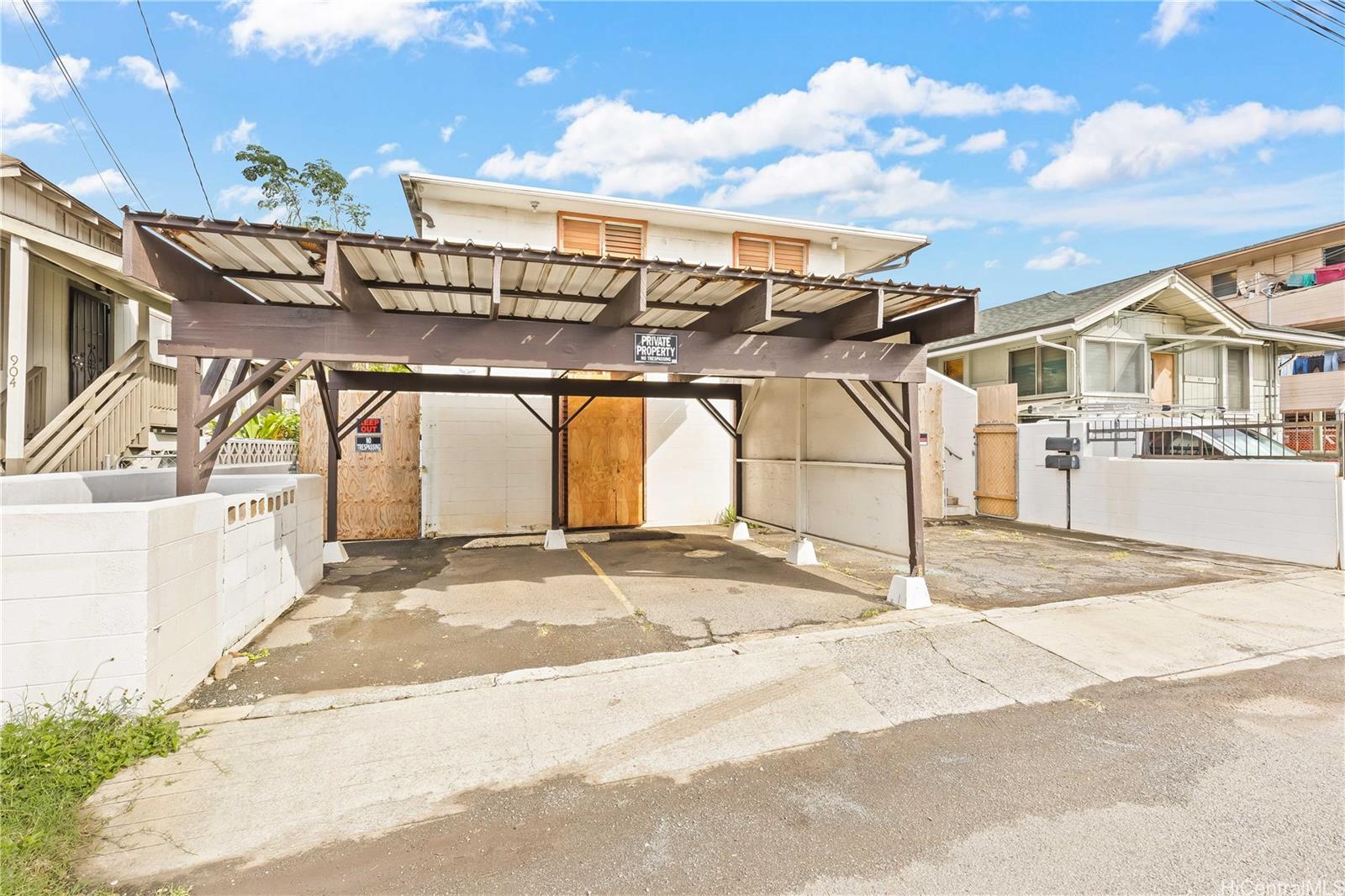 910 Factory Street Honolulu, HI 96819 - Photo 1 of 19 a view of a house with a patio