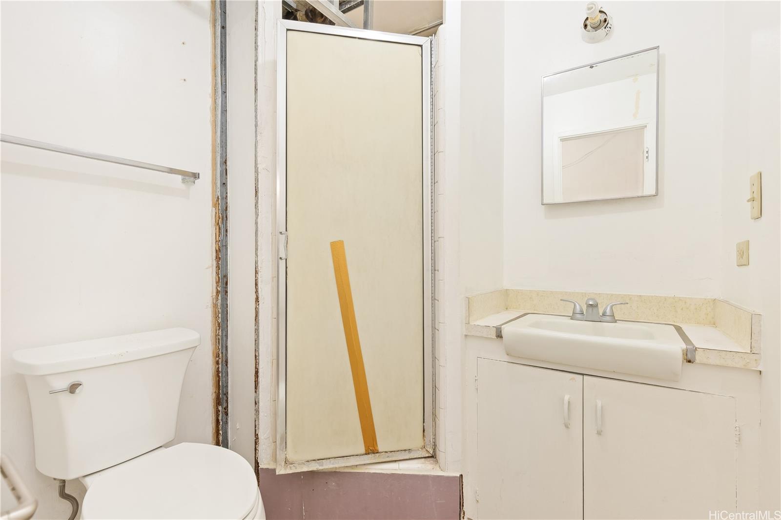 910 Factory Street Honolulu, HI 96819 - Photo 19 of 19 a bathroom with a sink and a mirror