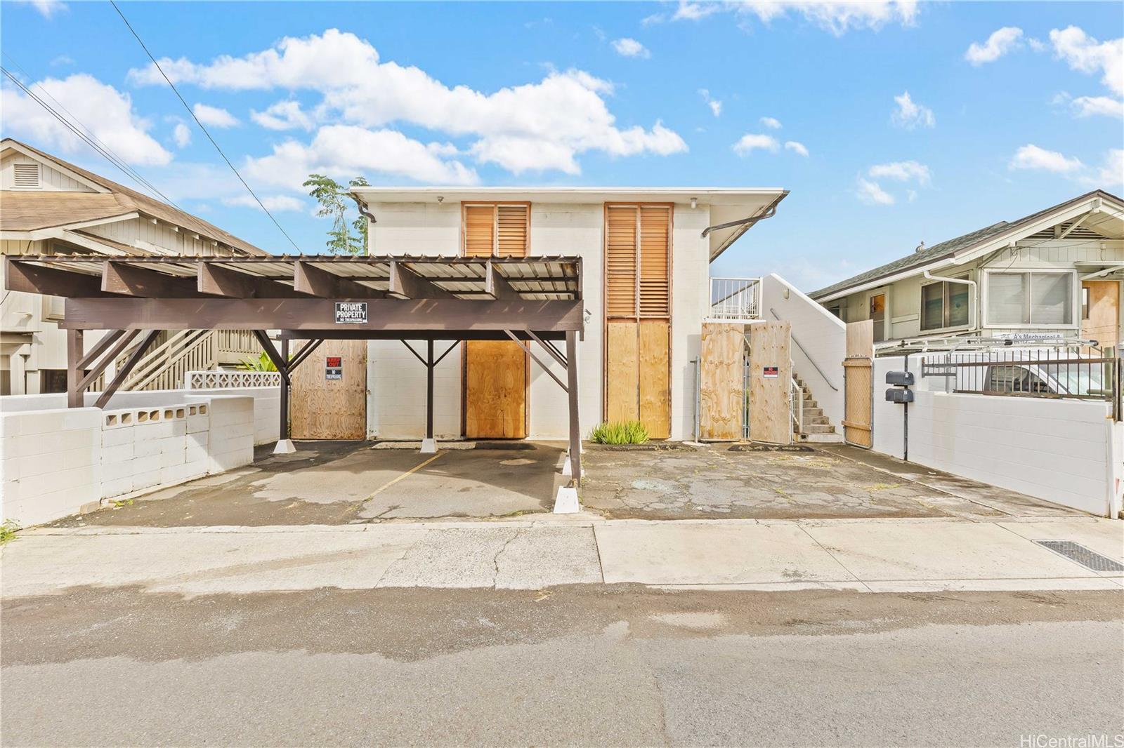910 Factory Street Honolulu, HI 96819 - Photo 2 of 19 a view of a house with a street