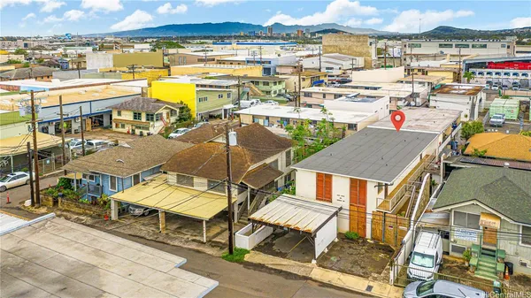 an aerial view of a city with lawn chairs
