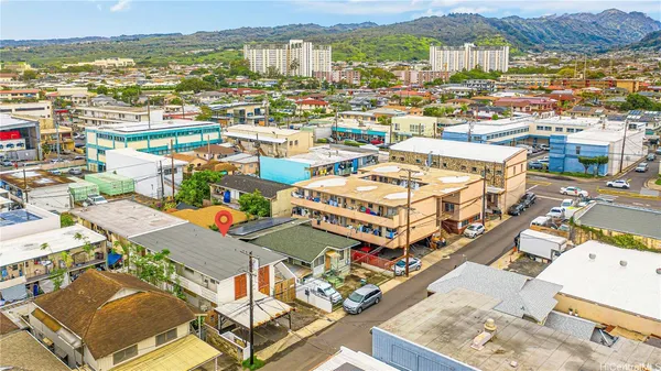 an aerial view of residential houses with outdoor space