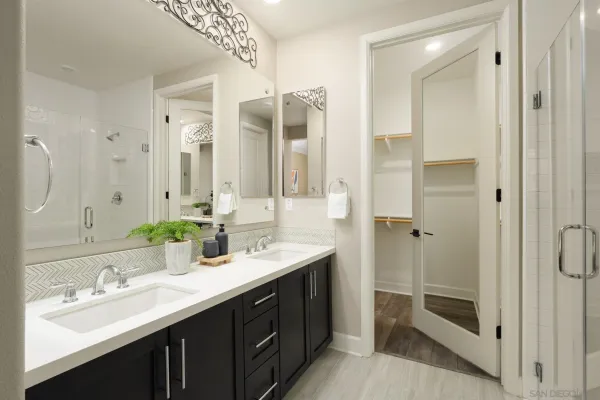 a bathroom with a double vanity sink mirror and double