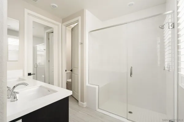 a bathroom with a sink and shower