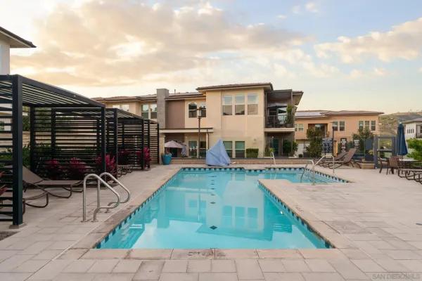 a view of a patio with swimming pool