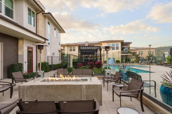 a view of a patio with couches and a table and chairs