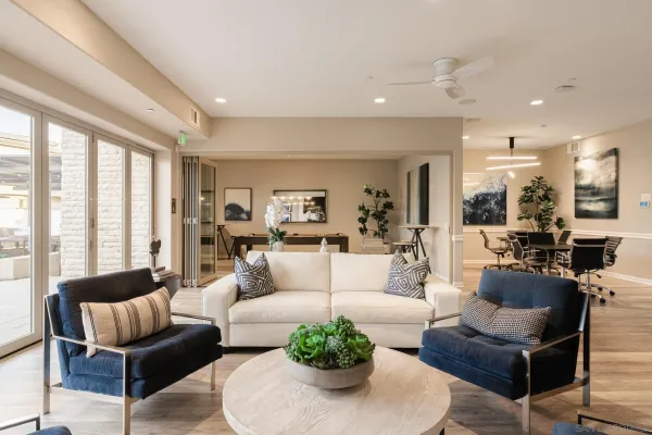 a living room with furniture and a large window