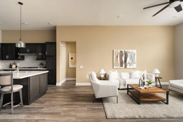 a living room with furniture and a wooden floor