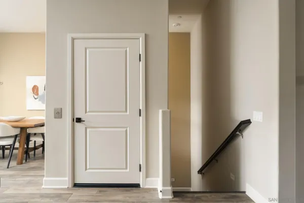 a view of entryway with furniture and wooden floor