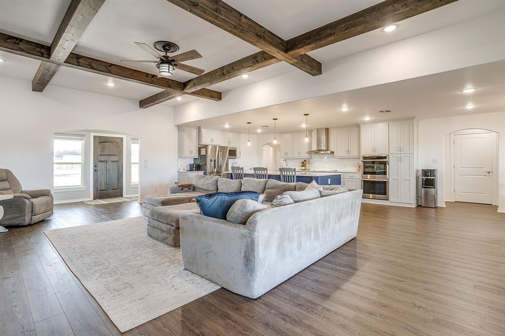 733 Fm 2652 Graham, TX 76450 - Photo 8 of 40 a living room with furniture and a wooden floor