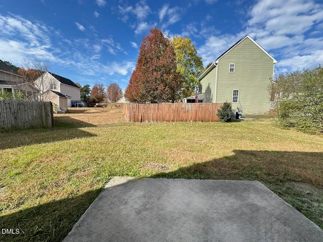 a view of a back yard of the house