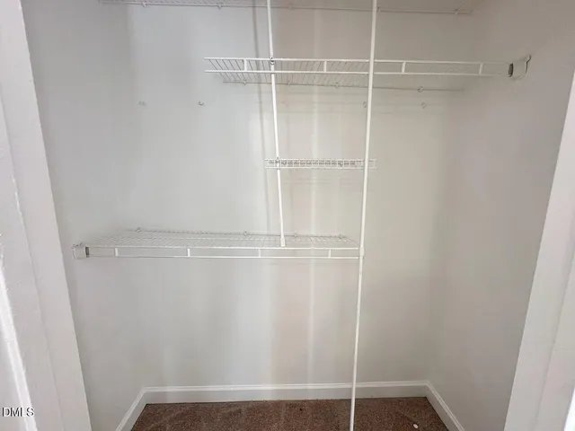 a view of an empty walk in closet