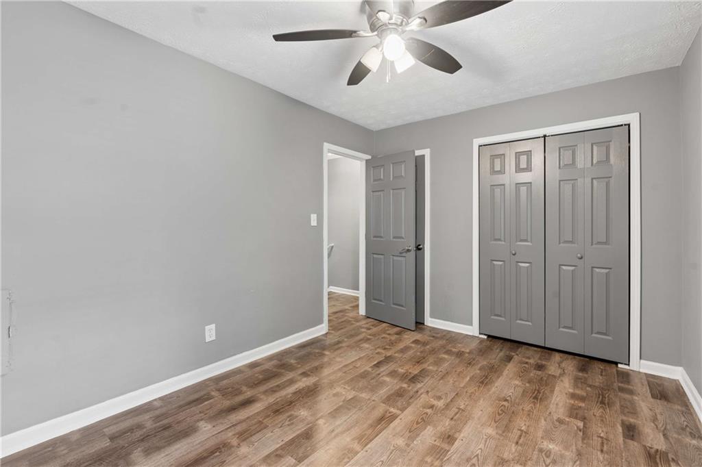 1235 Riverside Drive, Unit C8 Gainesville, GA 30501 - Photo 12 of 24 a view of an empty room and chandelier fan