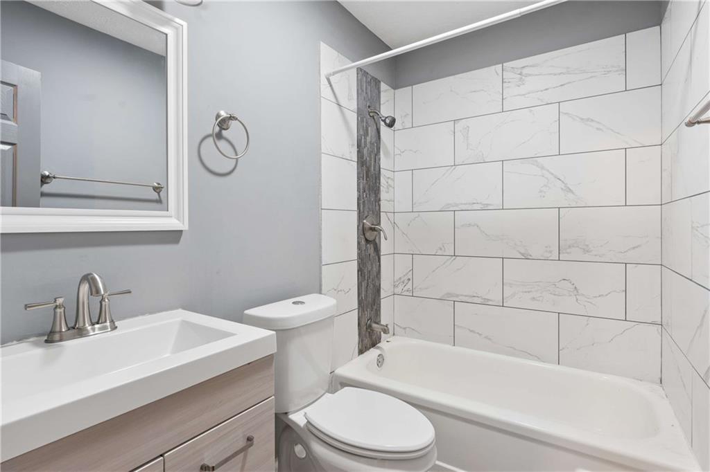 1235 Riverside Drive, Unit C8 Gainesville, GA 30501 - Photo 13 of 24 a bathroom with a sink toilet and shower