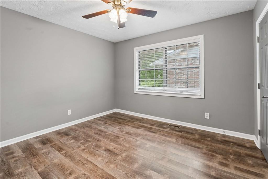 1235 Riverside Drive, Unit C8 Gainesville, GA 30501 - Photo 14 of 24 a view of an empty room with a window