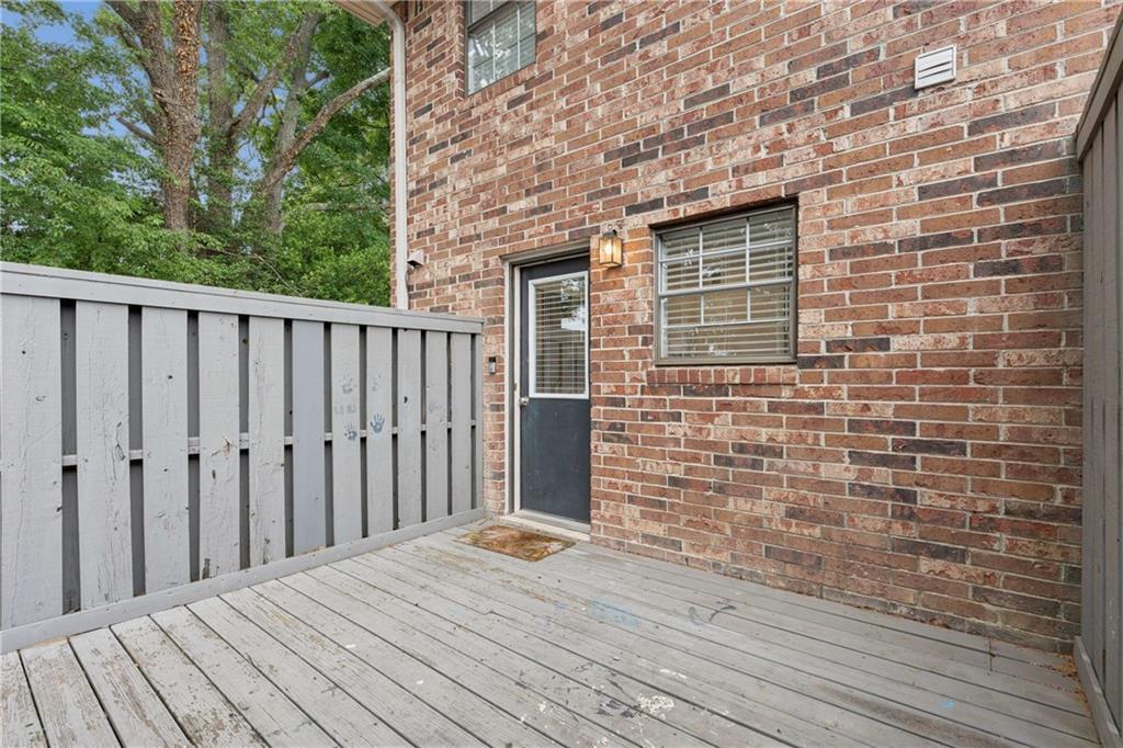 1235 Riverside Drive, Unit C8 Gainesville, GA 30501 - Photo 17 of 24 a view of a wooden deck