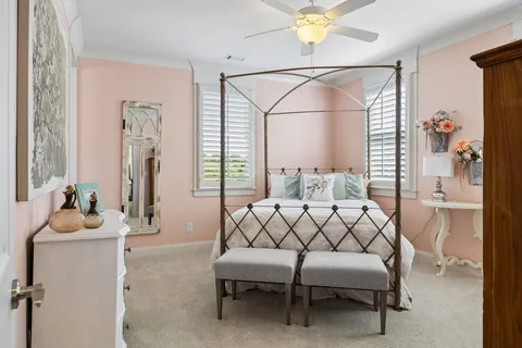 a bedroom with furniture and a window