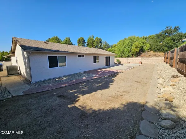 a view of a back yard with an outdoor space