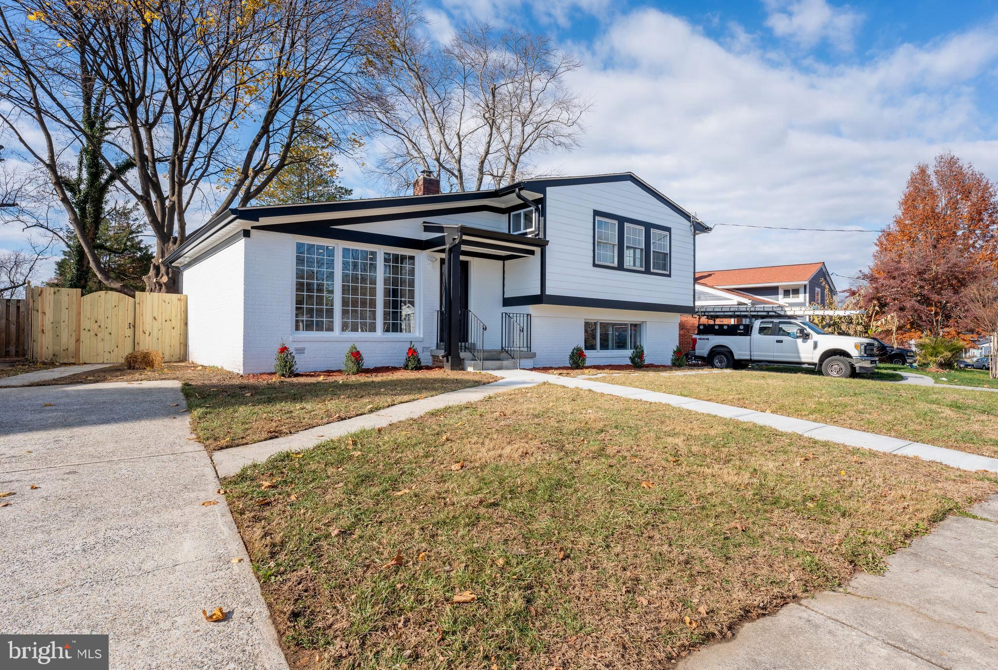 13208 Holdridge Road Silver Spring, MD 20906 - Photo 2 of 29 a front view of a building with a yard