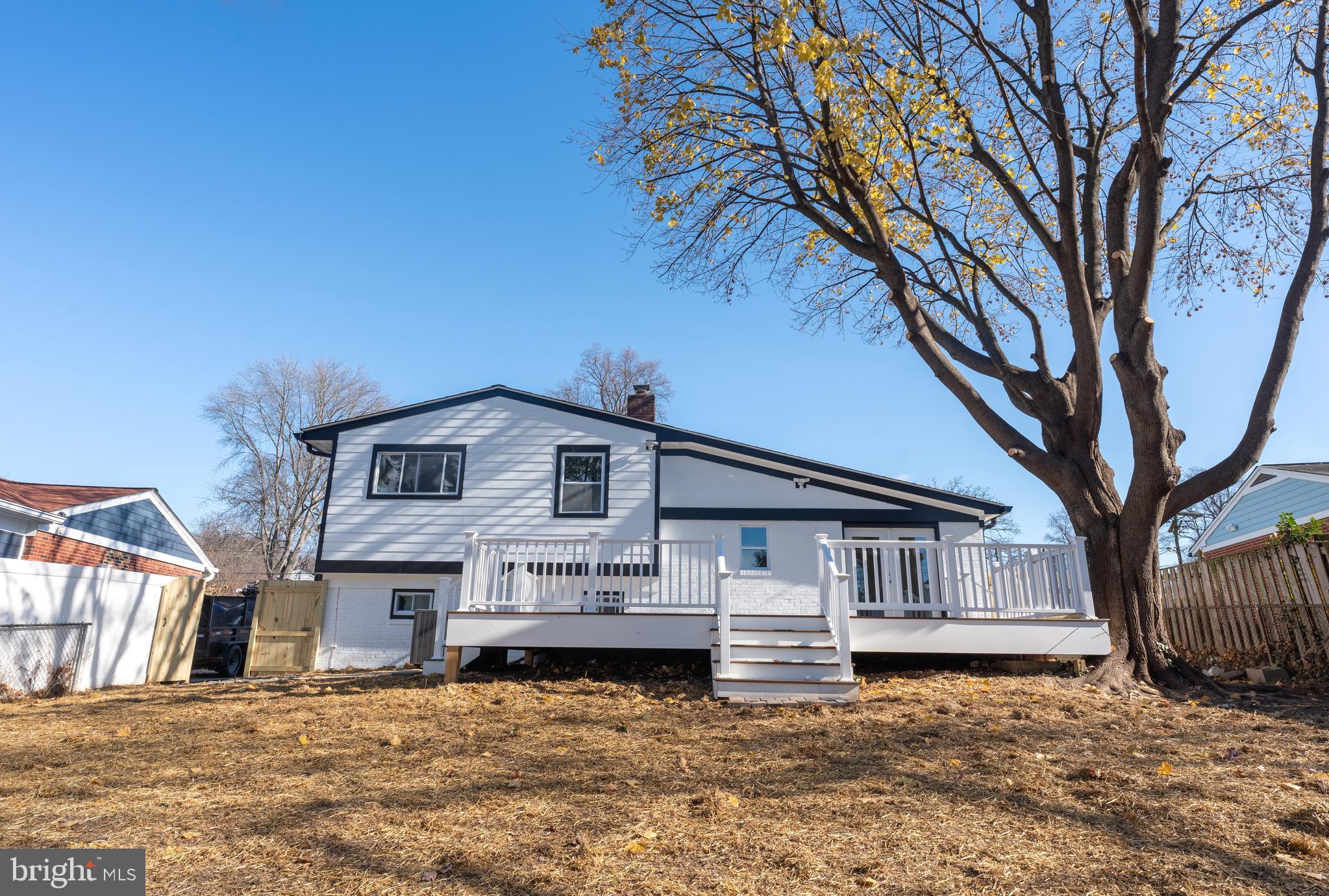 13208 Holdridge Road Silver Spring, MD 20906 - Photo 27 of 29 a white house that has a tree in front of it