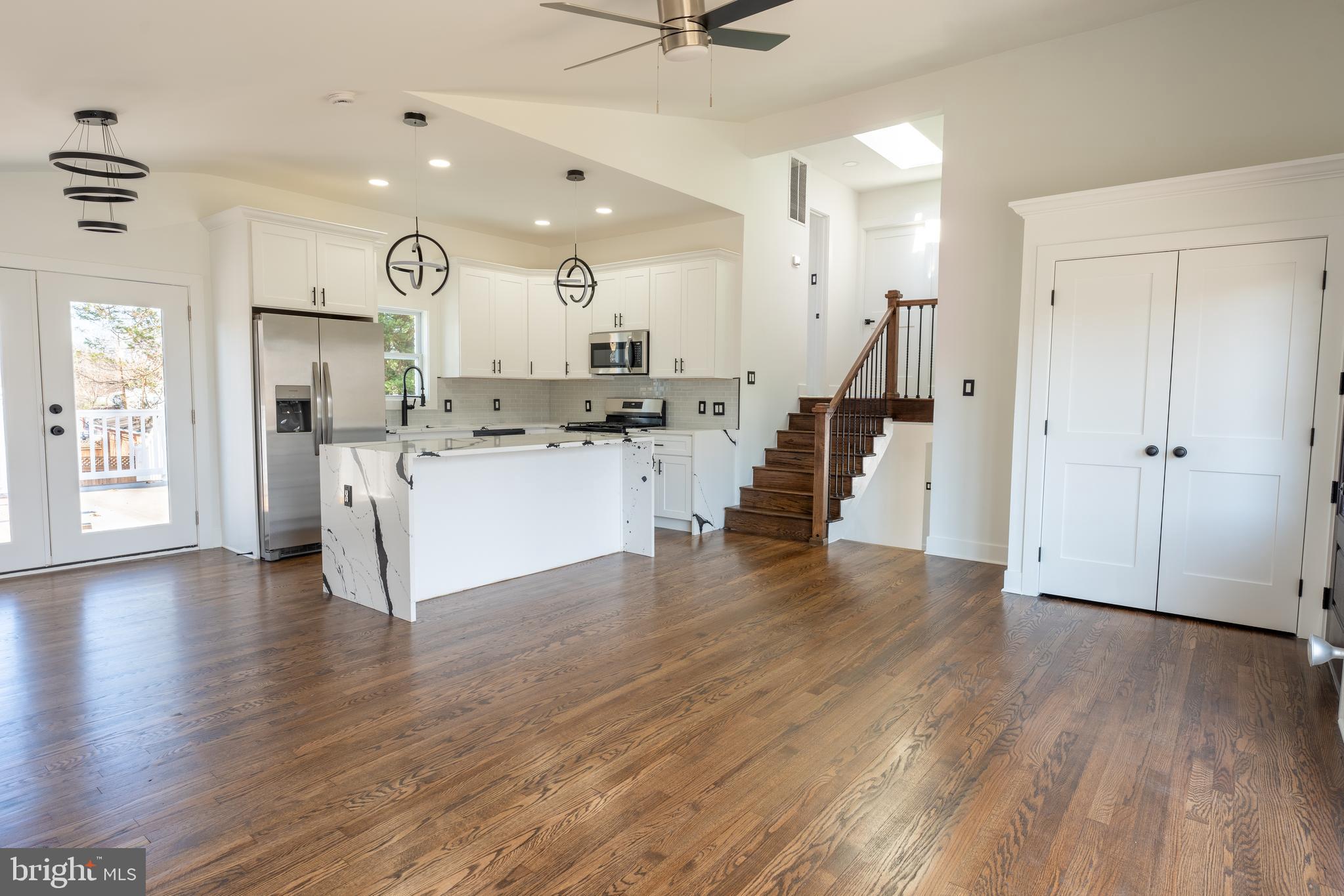 13208 Holdridge Road Silver Spring, MD 20906 - Photo 4 of 29 a view of a kitchen with wooden floor and a window