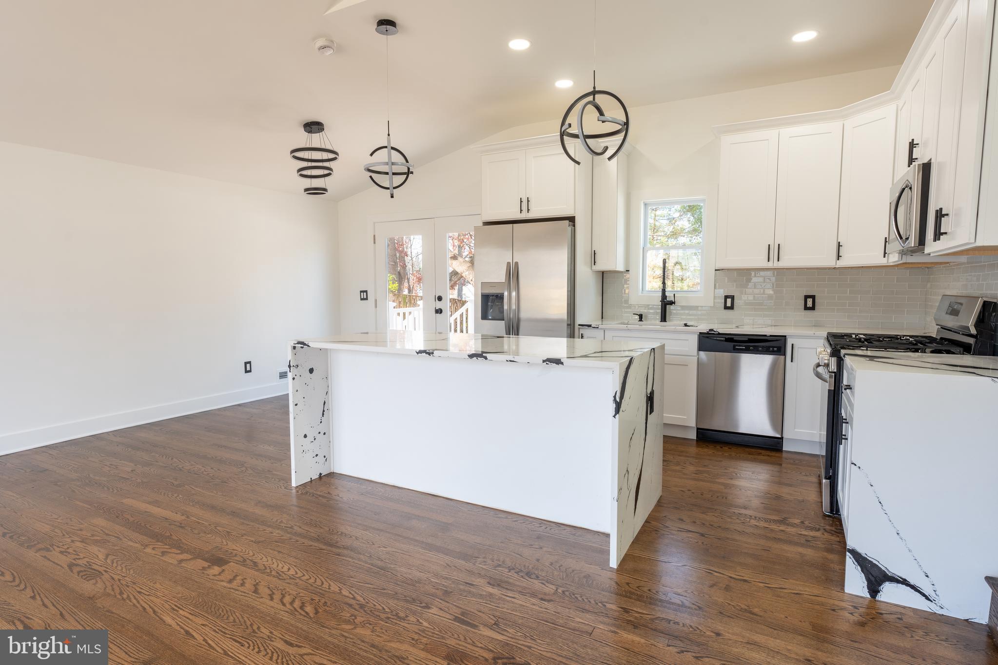 13208 Holdridge Road Silver Spring, MD 20906 - Photo 5 of 29 a kitchen with cabinets a sink and appliances
