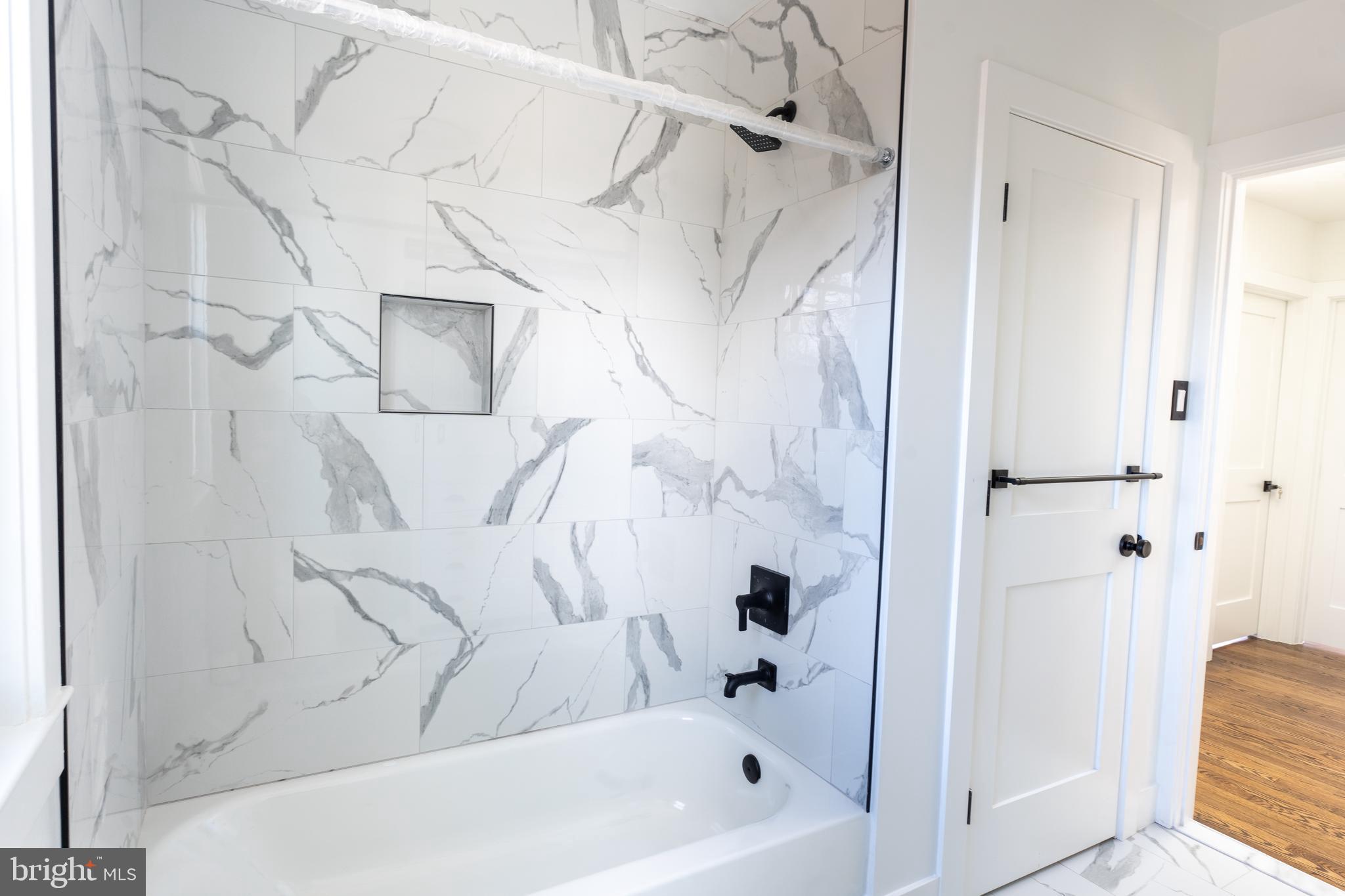 13208 Holdridge Road Silver Spring, MD 20906 - Photo 8 of 29 a bathroom with a bathtub and shower