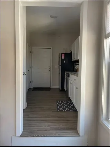 a view of a kitchen from the hallway