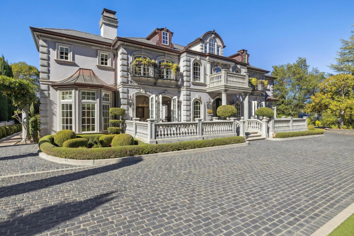 15253 Montalvo Road Saratoga, CA 95070 - Photo 103 of 107 a front view of a house with a yard and potted plants