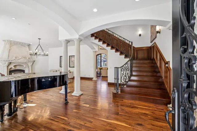 a kitchen with a sink dining table and chairs