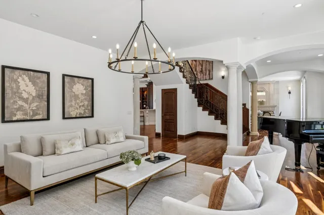 a room with wooden floor and large windows