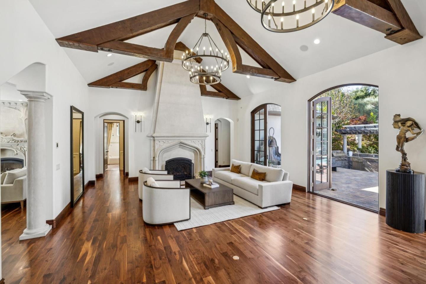 15253 Montalvo Road Saratoga, CA 95070 - Photo 22 of 107 a living room with furniture a fireplace and wooden floor