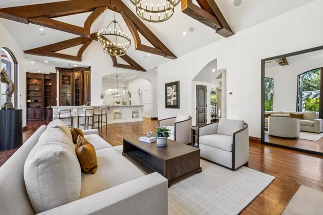 swimming pool view with a seating space and garden view