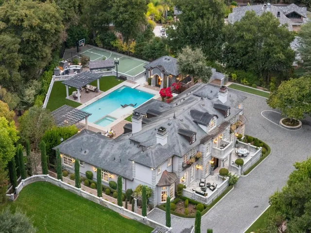 a view of a swimming pool with outdoor seating