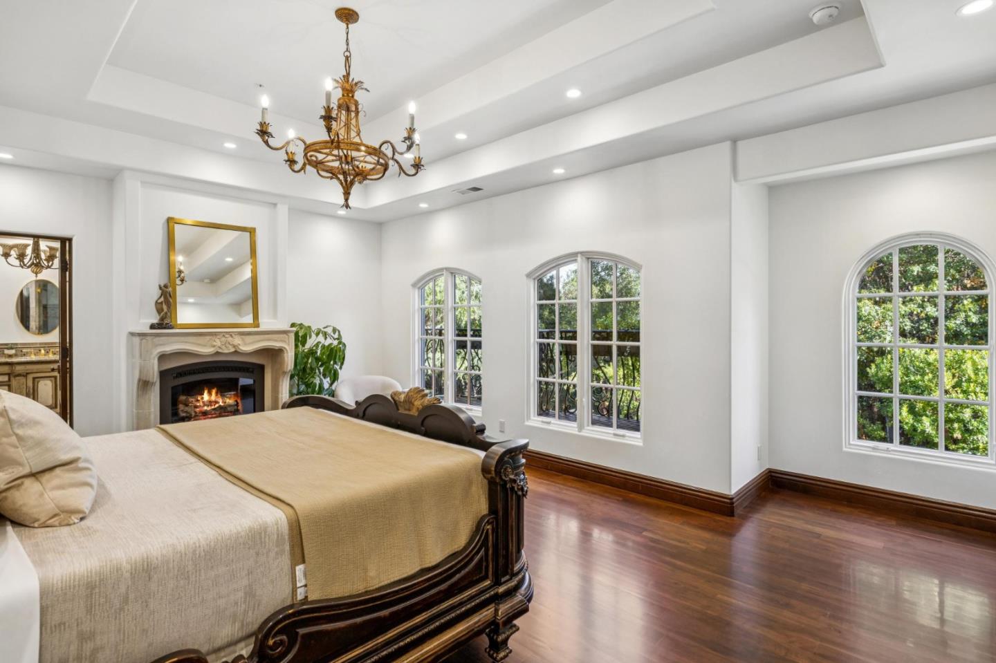 15253 Montalvo Road Saratoga, CA 95070 - Photo 57 of 107 a spacious bedroom with a balcony a bed dresser and a window