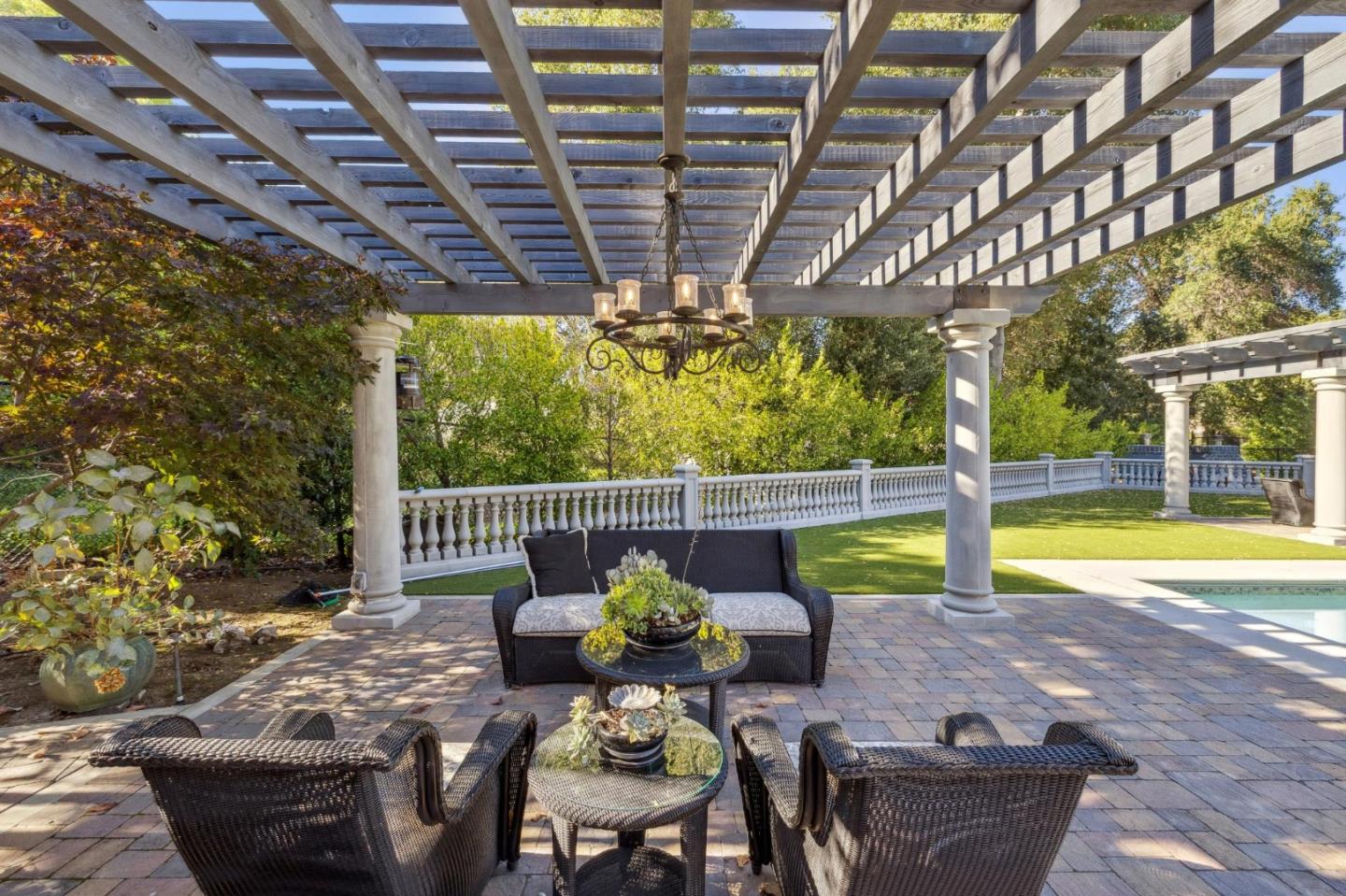 15253 Montalvo Road Saratoga, CA 95070 - Photo 75 of 104 a swimming pool with potted plants and large trees