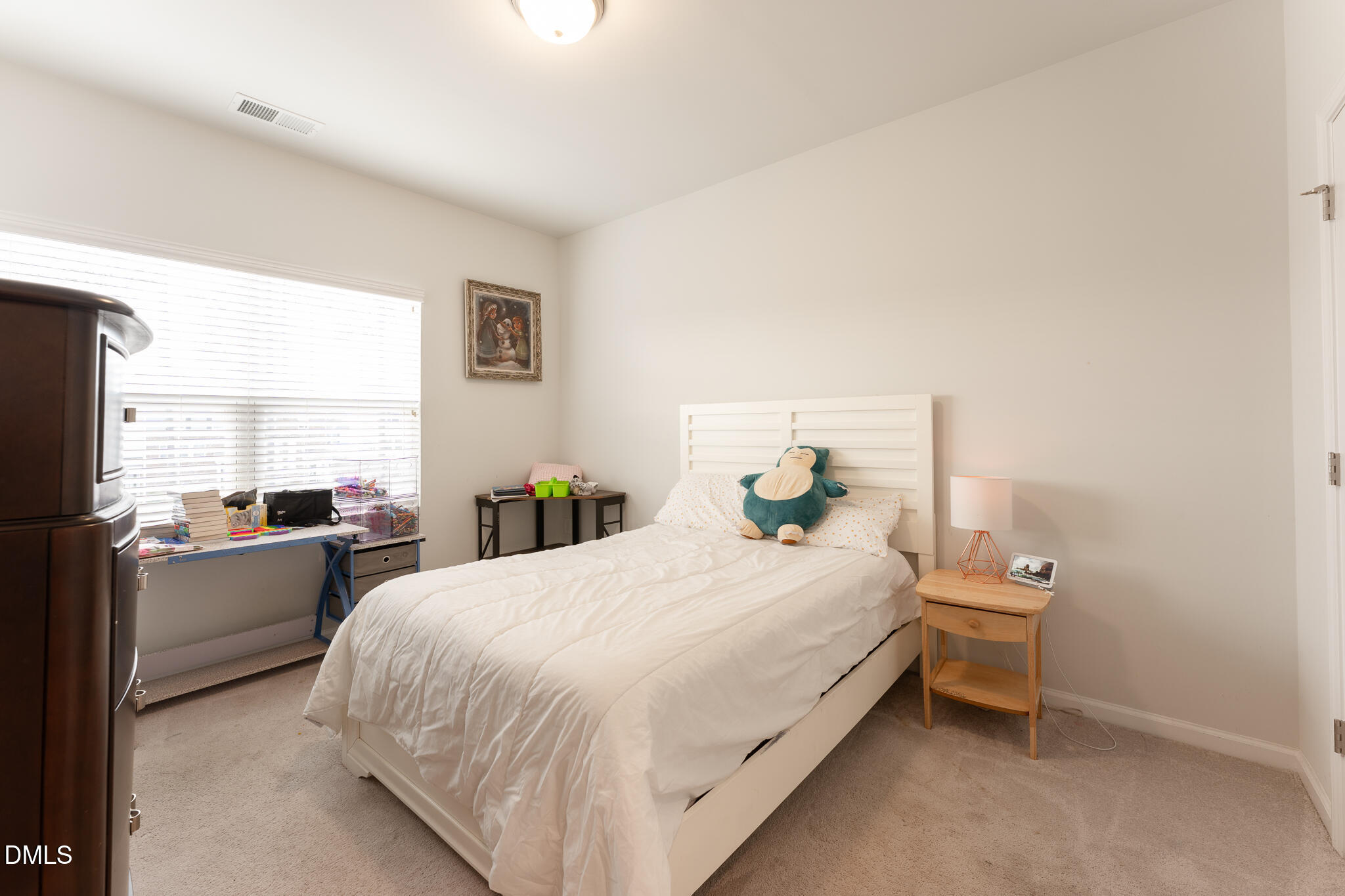 1296 Barn Cat Way Apex, NC 27502 - Photo 15 of 22 a bedroom with a bed and window