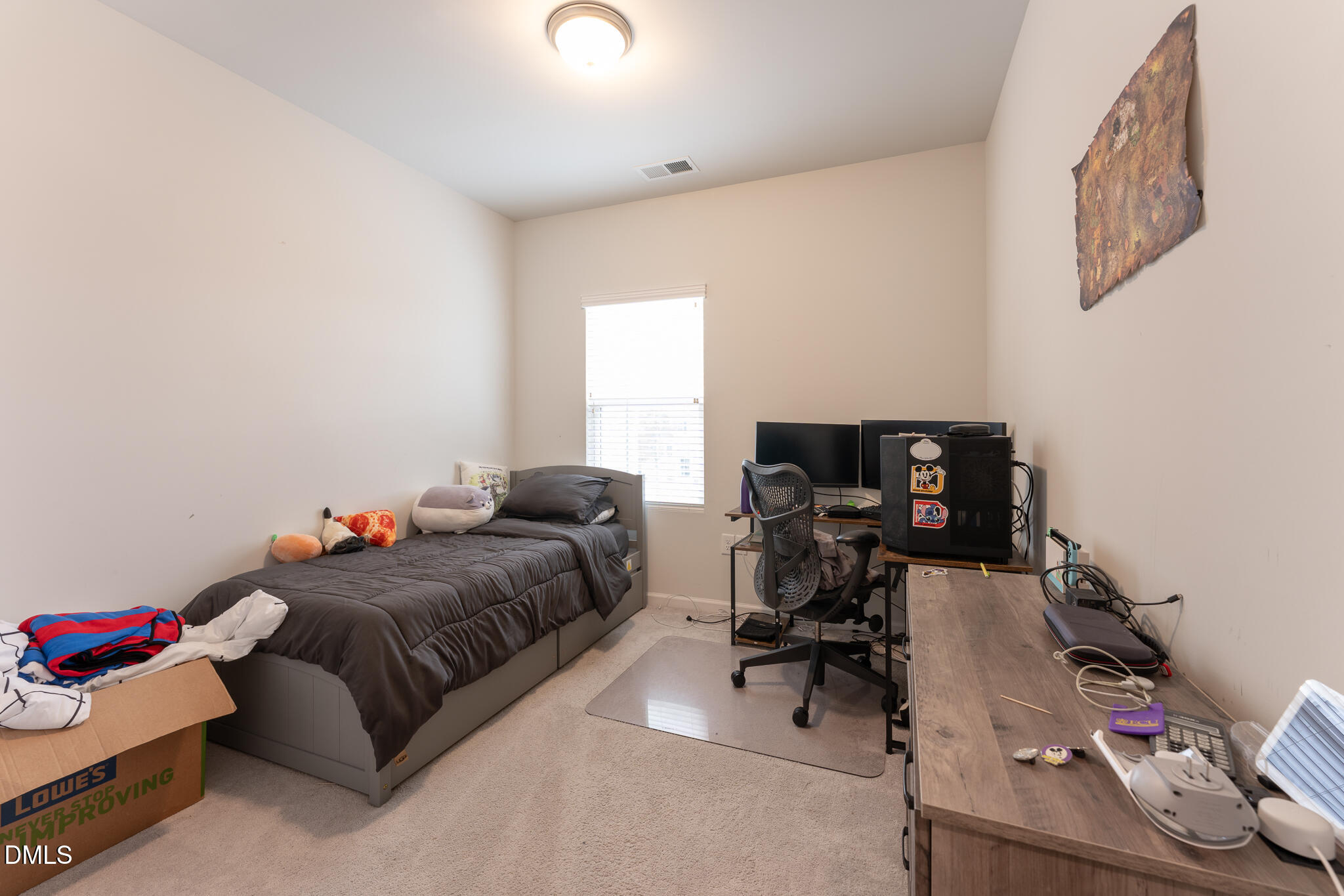 1296 Barn Cat Way Apex, NC 27502 - Photo 17 of 22 a bedroom with a bed and a desk