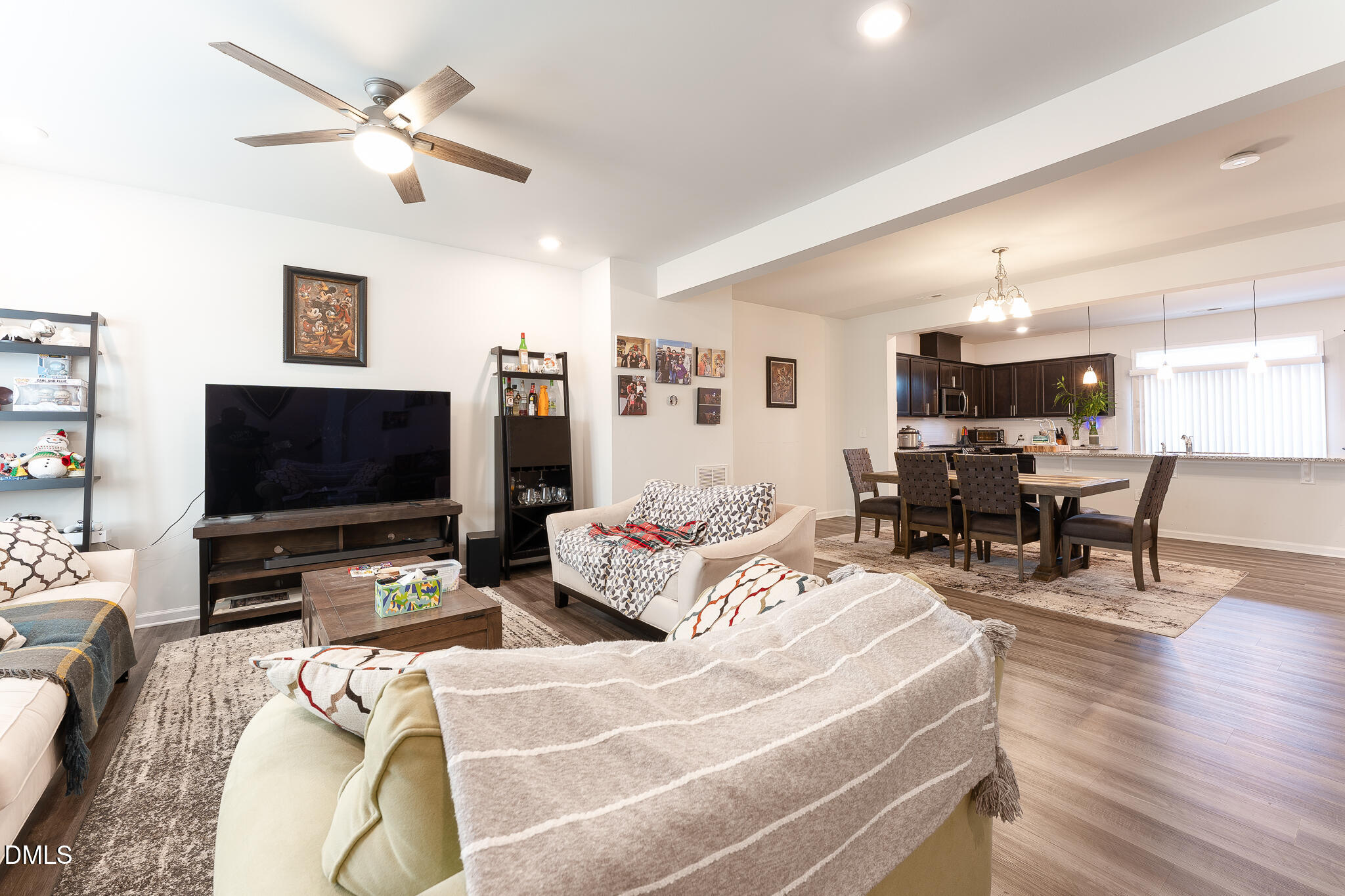 1296 Barn Cat Way Apex, NC 27502 - Photo 2 of 22 a living room with furniture and a flat screen tv