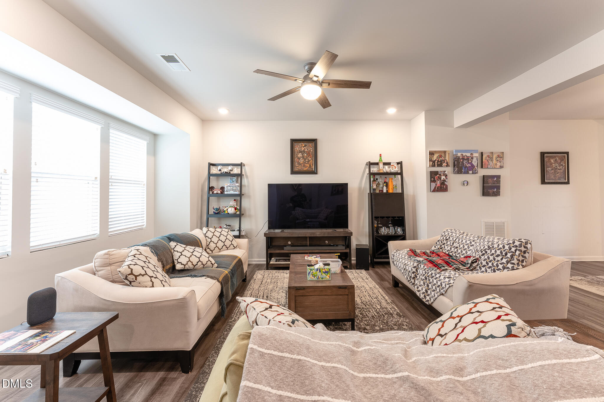 1296 Barn Cat Way Apex, NC 27502 - Photo 3 of 22 a living room with furniture and a flat screen tv
