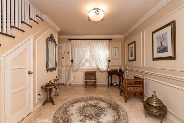 a bathroom with a double vanity sink a toilet a mirror and shower