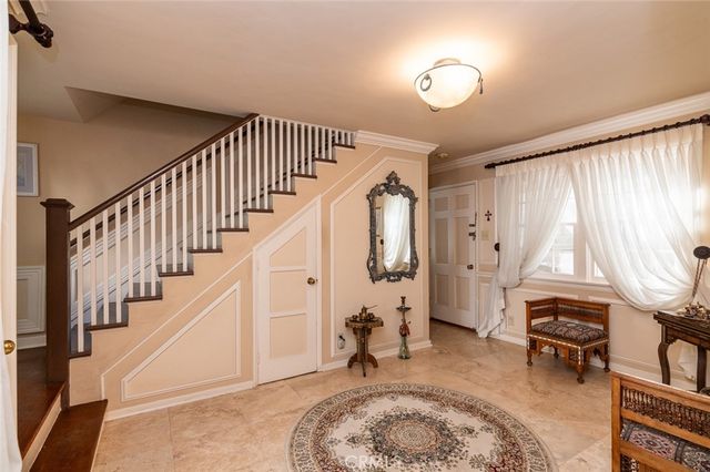 a bathroom with a toilet a sink and a window