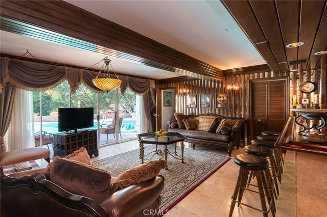 a view of a balcony with wooden floor and fence