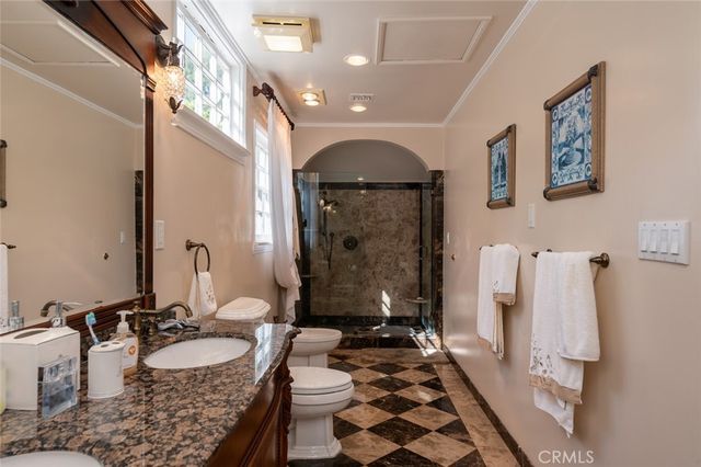 a view of a backyard with plants and outdoor seating